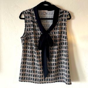 Cute breezy top with geometric design.